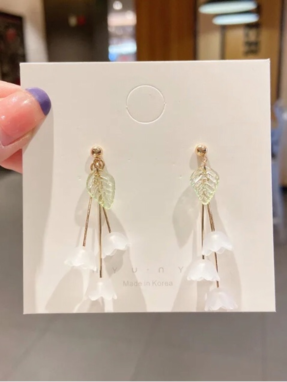 Delicate White Floral Drop Earrings with Green Leaf Accent